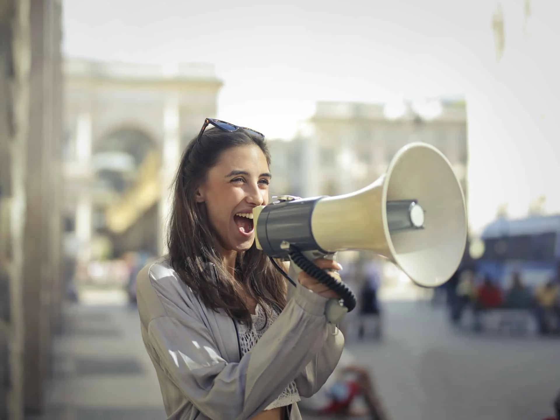 excited woman with bullhorn